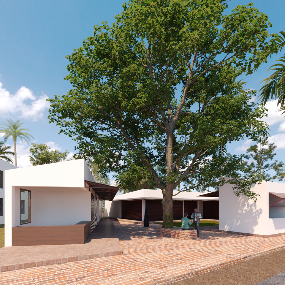 Courtyard gathering area beneath a large shade tree and adjoining wings