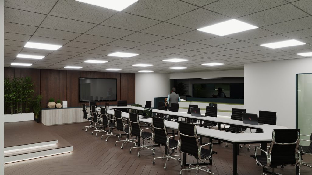 Conference room with rows of tables, task chairs and presentation wall