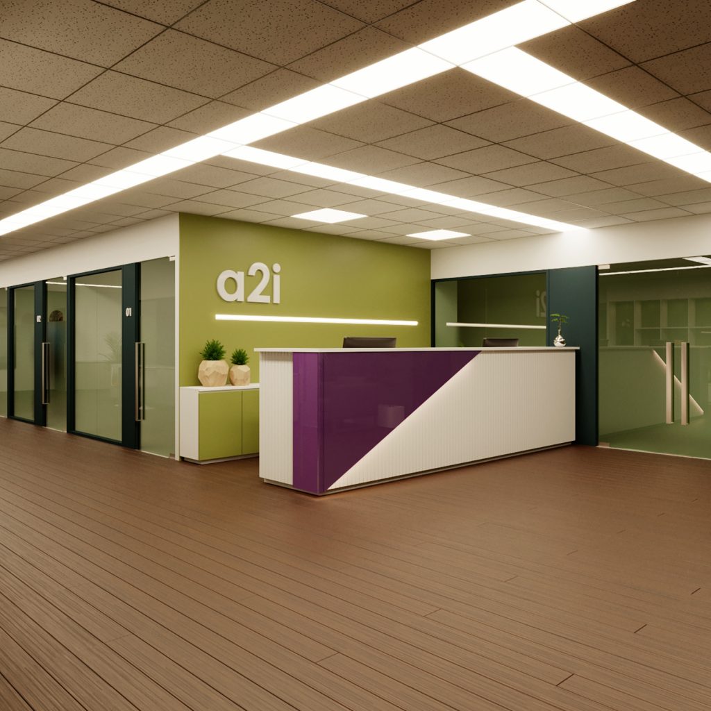 Reception counter with A2i branding on wall partition and storage