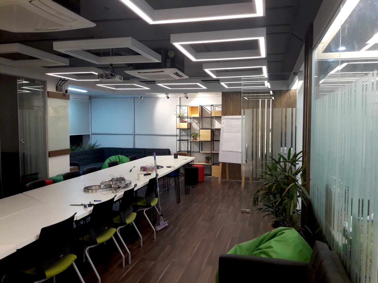 Conference space with custom furniture and ceiling lighting at BDBL Tower office