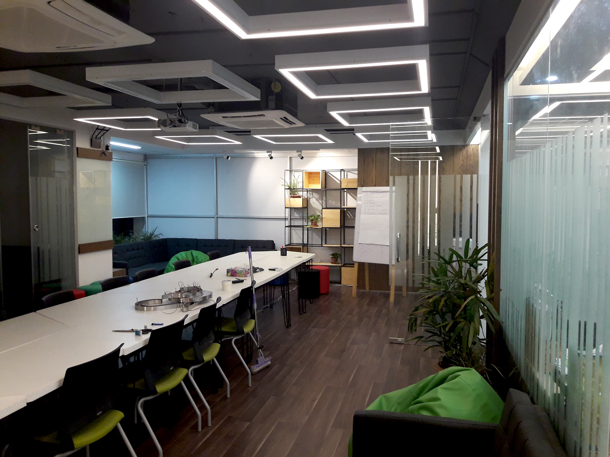 Conference space with custom furniture and ceiling lighting at BDBL Tower office