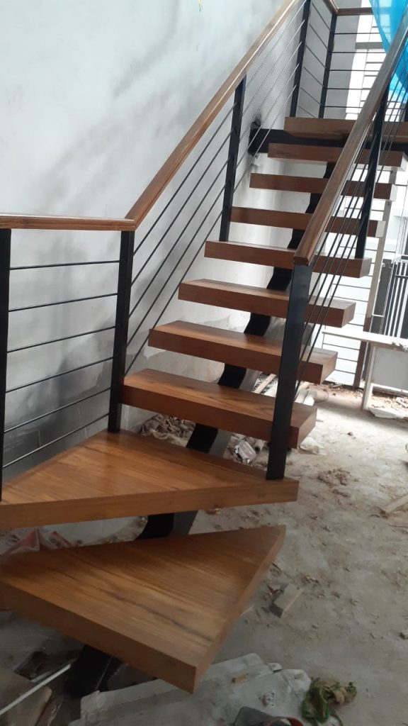Wooden Schluter staircase under construction in duplex residence