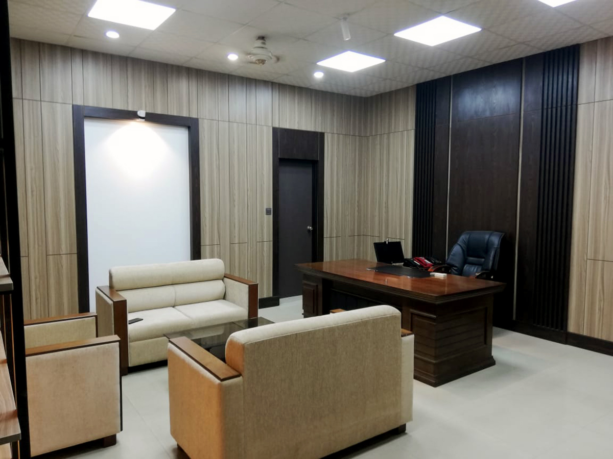 Executive office waiting and meeting area with custom furniture and wall paneling