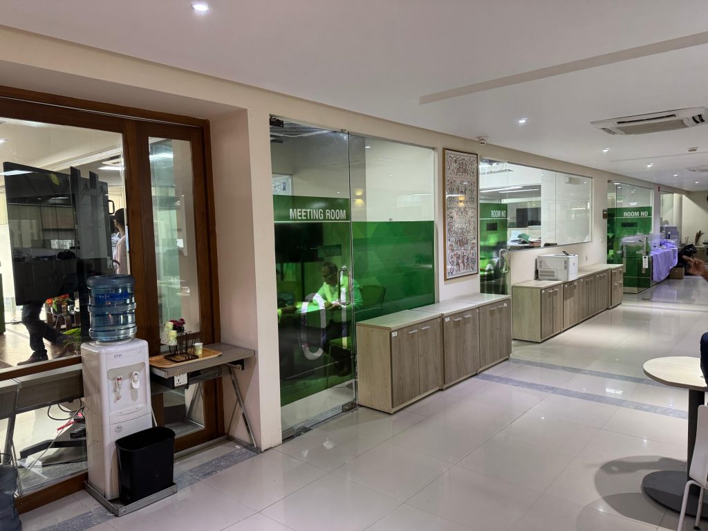 Office corridor with glass partitions and panels