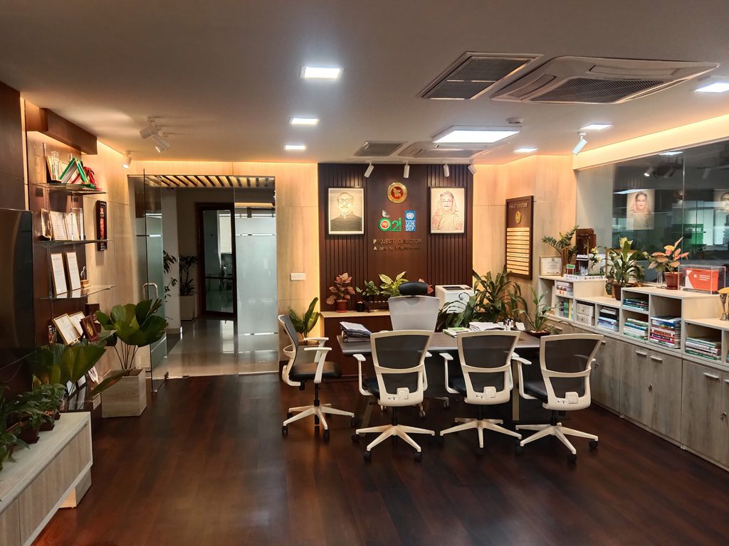 Long view showing desk, exicutive table, and circulation in the director room, ICT Tower Dhaka