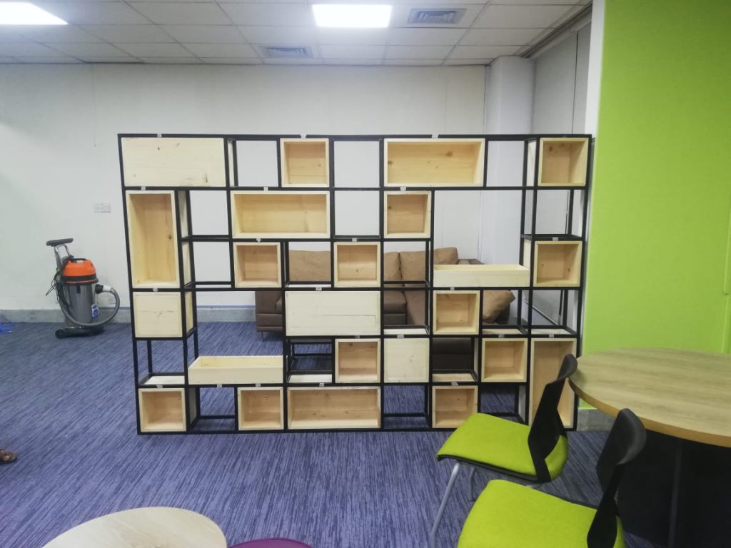 Modular storage partition wall made with karosin wood and ms steel, furniture in Bangladesh.