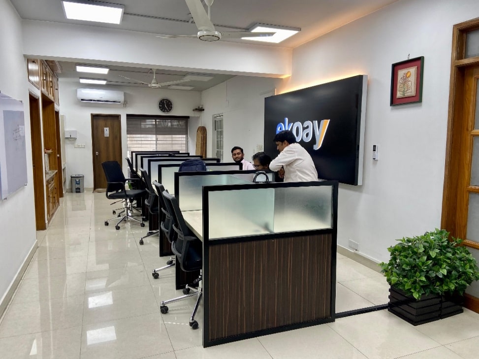 Open workstations with partition and Ek-Pay logo wall in Mohakhali DOHS office