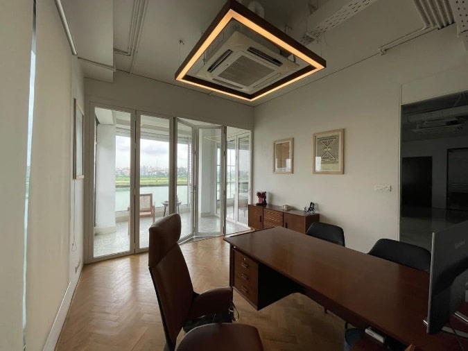 MD room with custom table, ceiling feature and sliding doors to terrace view