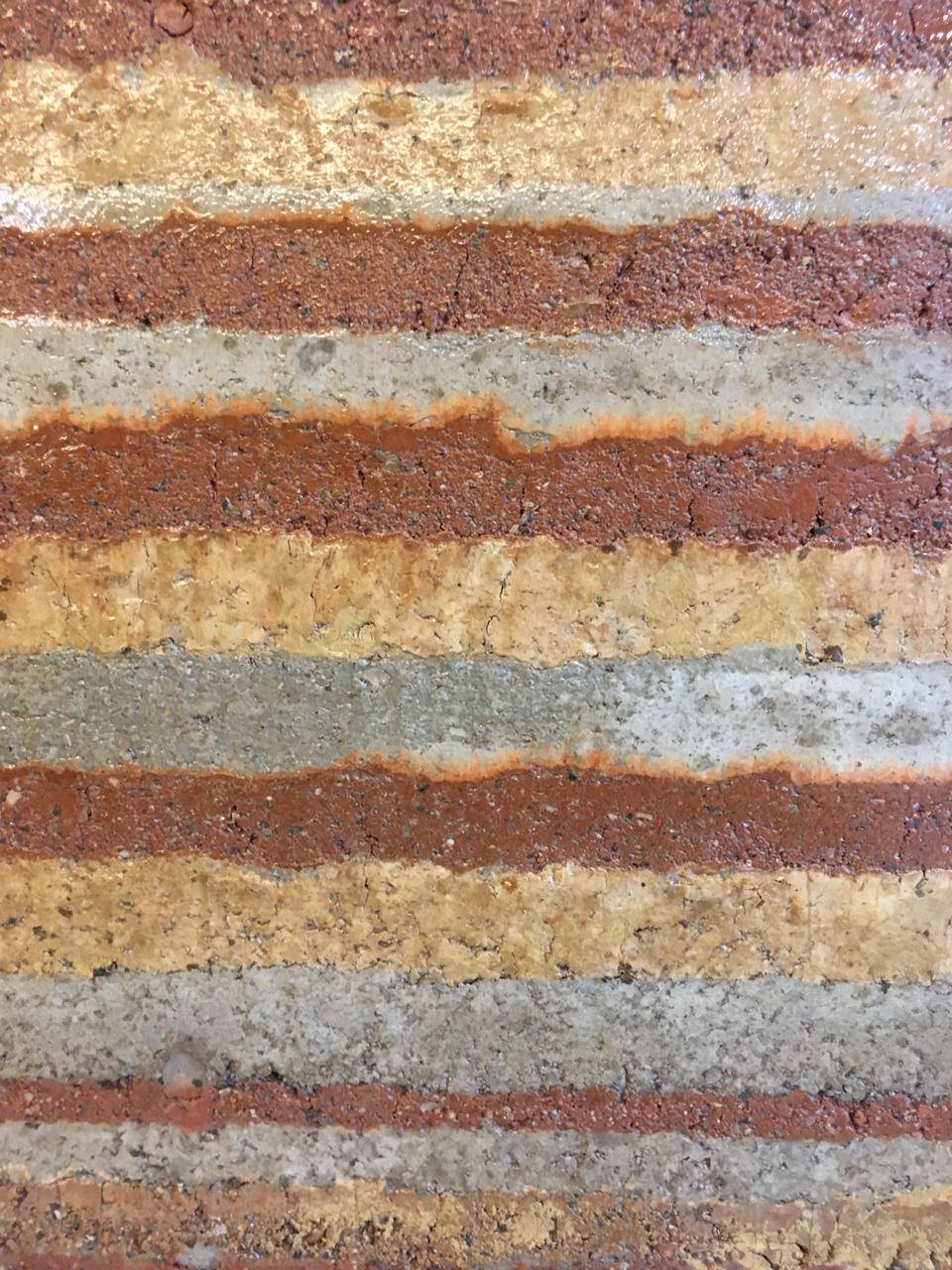Close-up of layered mud wall texture finish in earthy tones, small office interior, Pritam Zaman Tower, Dhaka