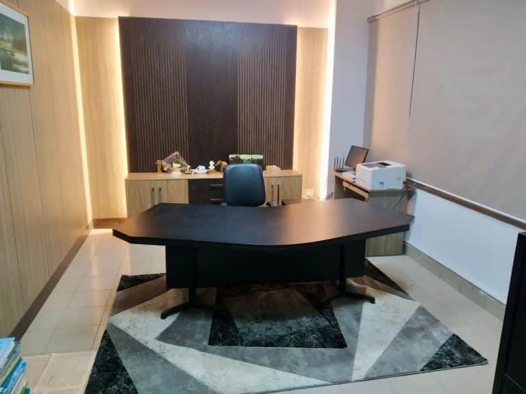 MD room interior in Dhaka with executive desk, storage wall and visitor seating